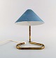 Scandinavian design. Adjustable desk lamp. Foot in patinated brass. Light blue 
screen. 1950