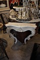 Swedish 1900 Century console with curved legs, decorative carvings and white 
marble on top.