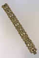 Georg Jensen 
18K Gold 
Diamondstudded 
Bracelet No 
17(1930-45) 19 
cm(7 ½ in) L 
Weight 38.2 
gr/1.35 oz