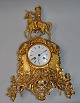 French 
gilt-bronze 
marble clock, 
approx. 1830. 
Top figure in 
the form of a 
king. At lower 
part ...