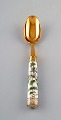 Georg Jensen for Royal Copenhagen. "Flora Danica" dinner spoon of gold plated 
sterling silver. Porcelain handle decorated in colors and gold with flowers.