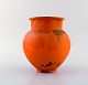Svend Hammershøi for Kähler, Denmark. Vase in glazed stoneware. Beautiful orange 
uranium glaze. 1940
