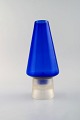 Per Lütken for Holmegaard. Rare "Hygge" lamp for candles in blue and clear art 
glass. Designed in 1958.