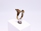 Ring of 8 carat 
gold with 
cultured pearl 
and stamped HS.
Size - 53.