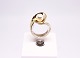 Ring of 14 
carat gold 
decorated with 
cultured pearl.
Size - 54.