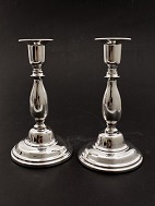 A pair of 830s silver candlesticks sold