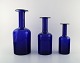 Otto Brauer for Holmegaard. Three large vases / bottles in dark blue art glass. 
1960