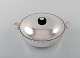 Just Andersen 
lidded bowl 
with handles in 
sterling 
silver. Edge 
adorned with 
chisels and lid 
...