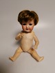 Small porcelain 
doll Germany 
appears in 
age-related 
condition.