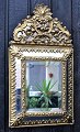 German mirror 
19th century 
Baroque form. 
Brass. H. 58, 
B. 31 cm