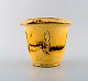 Svend Hammershøi for Kähler, Denmark. Rare vase / flower pot in glazed 
stoneware. Beautiful yellow uranium glaze. 1930 / 40