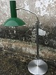Hans Schmidt's 
lamp design: 
adjustable lamp 
in green metal. 
Ca. height 
between 70 and 
100 cm