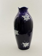 Blue ceramic vase with flowers