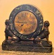 Large art deco mantel clock in green marble and bronze in the form of sphinxes. ca. 1930. With ...