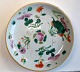 Chinese famille rose plate, 19th century. Decorated with signs and flowers. Stamped. Diameter: ...