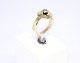 Ring of 14 
carat gold with 
simpel design.
Size - 58.