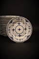 Royal 
Copenhagen Blue 
Fluted 
half-lace 
dessert plate. 
Dia.:14cm. 
Decoration 
number: ...