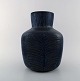 Eva Stæhr-Nielsen for Saxbo. Large vase of stoneware in modern design. 
Horizontal grooves and beautiful glaze in deep blue shades. 1940 / 50