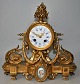 French ormelu 
mantel clock, 
19th century 
Rococo style. 
Decoration with 
procelain 
plaque with ...