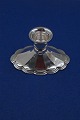 Candlestick of 
830 silver on 
oval filled 
stand, and in a 
good used 
condition.
H 6cm
L stand 10cm