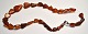 Amber chain of 
triangular 
pieces, 19th 
century 
Denmark. 
Length: 44 cm.