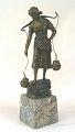 T. Jensen (19th century): A young woman getting water. Bronze figure mounted on a conical marble ...