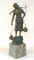 T. Jensen (19th 
century): A 
young woman 
getting water. 
Bronze figure 
mounted on a 
conical marble 
...