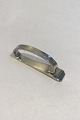 Georg Jensen 
"Pyramid" 
Sterling Silver 
Napkin Ring No. 
115. 7 cm L (2 
3/4"). 5.5 cm 
inner dia (2 
...