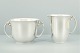 Georg Jensen 
silver vase. 
Harald Nielsen 
for Georg 
Jensen; A sugar 
bowl and 
creamer of ...