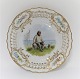 Royal 
Copenhagen. 
Plate with 
open-work 
border. 
Diameter 19 cm. 
Motiv; 
Fisherman from 
Skovshoved. ...