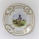 Royal 
Copenhagen. 
Plate with 
open-work 
border. 
Diameter 19 cm. 
Motiv; Man from 
Funen . 
Produced ...