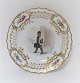Royal 
Copenhagen. 
Plate with 
open-work 
border. 
Diameter 19 cm. 
Motiv; Town 
mann. Produced 
before ...