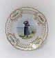 Royal 
Copenhagen. 
Plate with 
open-work 
border. 
Diameter 19 cm. 
Motiv; Girl 
from 
Blaavandshuk. 
...