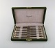 Bernard Yot for Christofle. Twelve "Aria" lunch knives in plated silver with 
gold accent. In original box.
