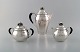 Rare Georg 
Jensen coffee 
service in 
sterling silver 
with ebony 
handles. Coffee 
pot, sugar bowl 
...