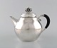 Rare Georg 
Jensen teapot 
in sterling 
silver with 
ebony handle. 
Dated 1915-30.
In very good 
...