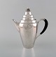 Rare Georg 
Jensen coffee 
pot in sterling 
silver with 
ebony handle. 
Dated 1915-30.
In very good 
...