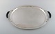 Johan Rohde for Georg Jensen. Colossal serving tray in sterling silver with 
ebony handles.

