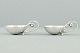 Georg Jensen 
Silver. 
Georg Jensen; 
A set of two 
salt cellars 
with spoons, 
hallmarked 
silver, ...