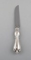 Hallbergs 
Guldsmeds Ab, 
Sweden. "Olga" 
cheese knife in 
silver and 
stainless 
steel. Dated 
...