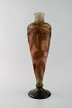 Emile Gallé 
vase in frosted 
and overlaid 
brown art glass 
carved with 
motifs in the 
form of ...
