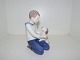 Large Bing & Grondahl figurine, boy with dog.The factory mark tells, that this was produced ...