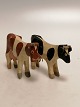 Black and brown 
variegated cows 
Prison toys 
Traces of wear 
H.6cm L.7.5cm.