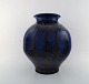Kähler, HAK, glazed stoneware vase in modern design. 1930 / 40s. Beautiful glaze 
in black and blue shades.
