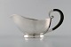 Cohr. Danish silversmith. Art deco sauce boat in silver (830) with ebony handle. 
Dated 1937.
