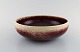 Sven Wejsfelt for Gustavsberg Studio Hand. Unique bowl in glazed ceramics. Dated 
1988. Beautiful ox blood glaze on cream colored background.
