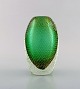 Murano, Italy. 
Vase in green 
mouth-blown art 
glass with 
bubbles and 
gold 
decoration. 
1960's.
In ...