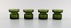 Jens Harald Quistgaard. Four "Hygge" light holders for teacandles in dark green 
art glass. Retro, 1960