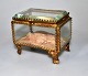 Jewelry box 
approx. 1900. 
France. With 
faceted glass 
and decorated 
brass frames 
and four legs. 
...