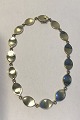 Georg Jensen 
Sterling Silver 
Neckless No 171 
Flemming 
Eskildsen 
Measures 40 
cm(15 3/4 in) 
Weight ...